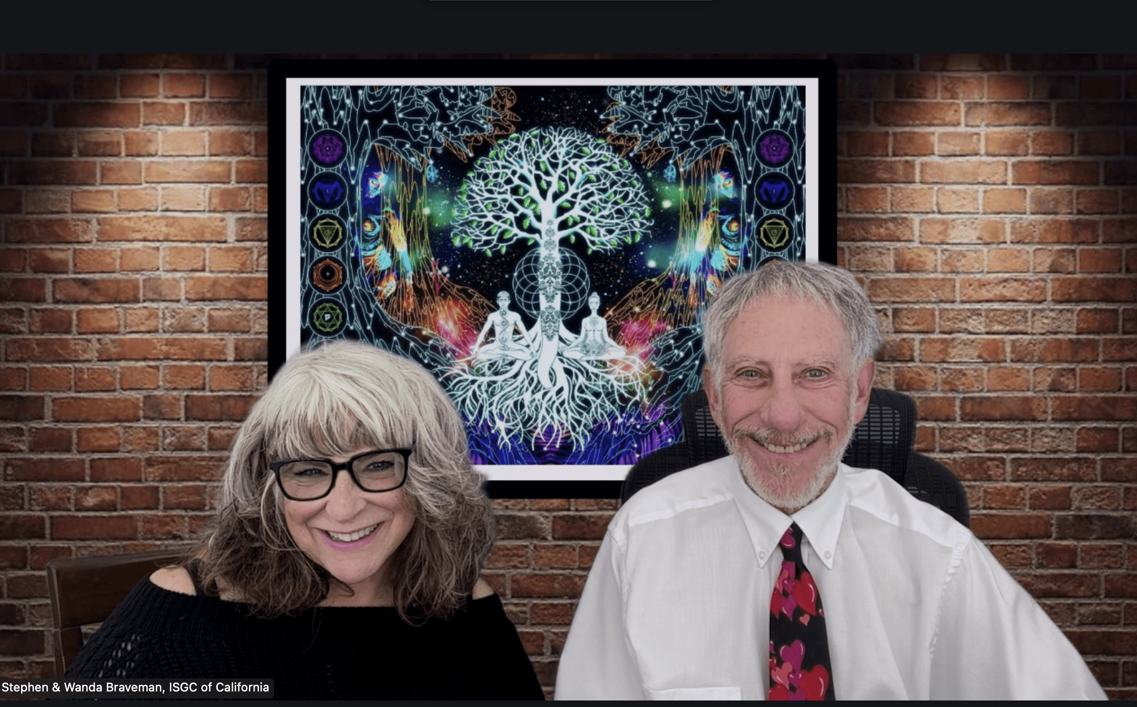 Stephen and Wanda Braveman with portrait in background